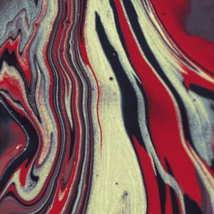 Vibrant abstract art featuring bold red and black swirls with a glittery texture.